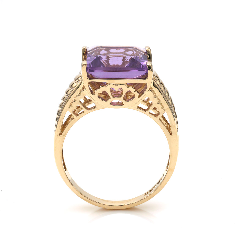 Princess amethyst ring in ornate yellow gold.