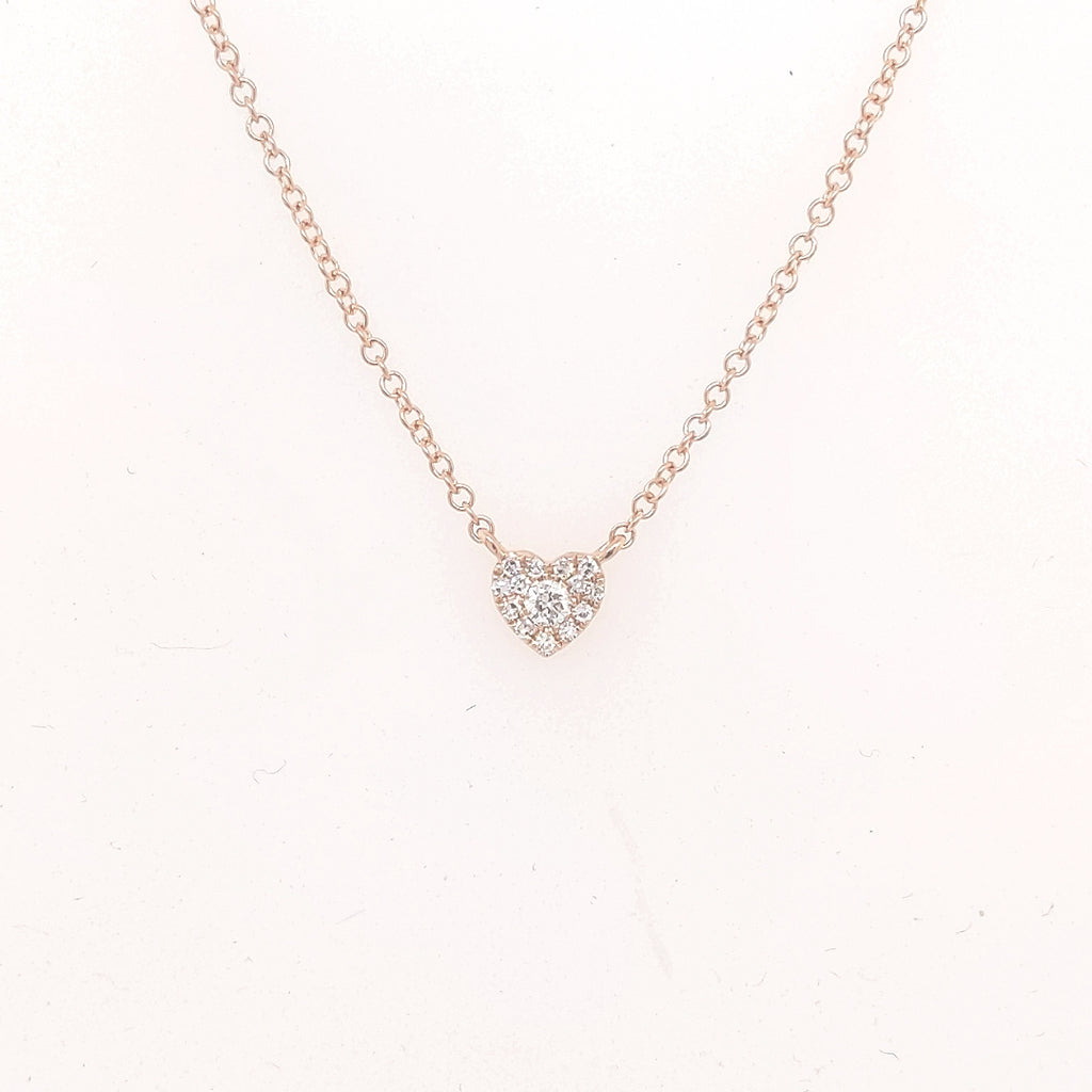Heart-shaped diamond necklace in rose gold.