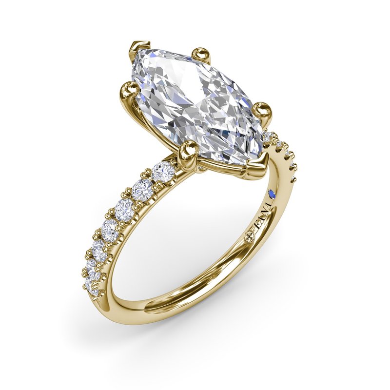 Marquise diamond ring with gold band.