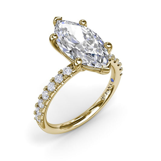 Marquise diamond ring with gold band.