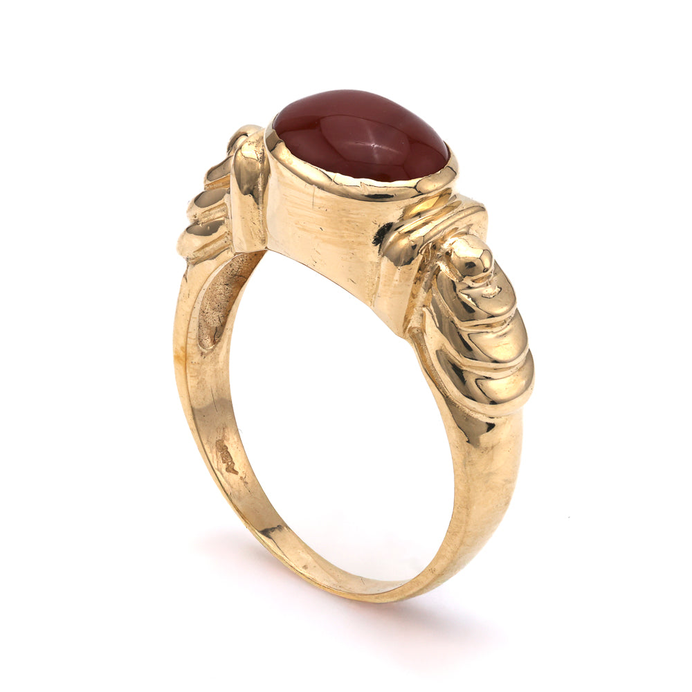 Carnelian cabochon ring in yellow gold.