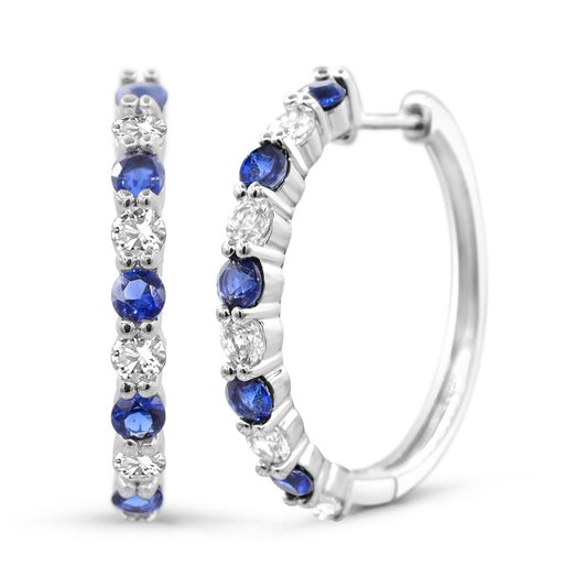 Sterling silver hoops with blue sapphires.