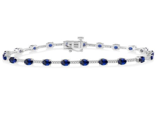 Oval sapphire and diamond station bracelet.