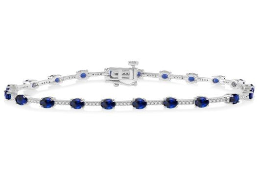 Station Color Gemstone Bracelet in 10 Karat White with 21 Oval Sapphires 4mm