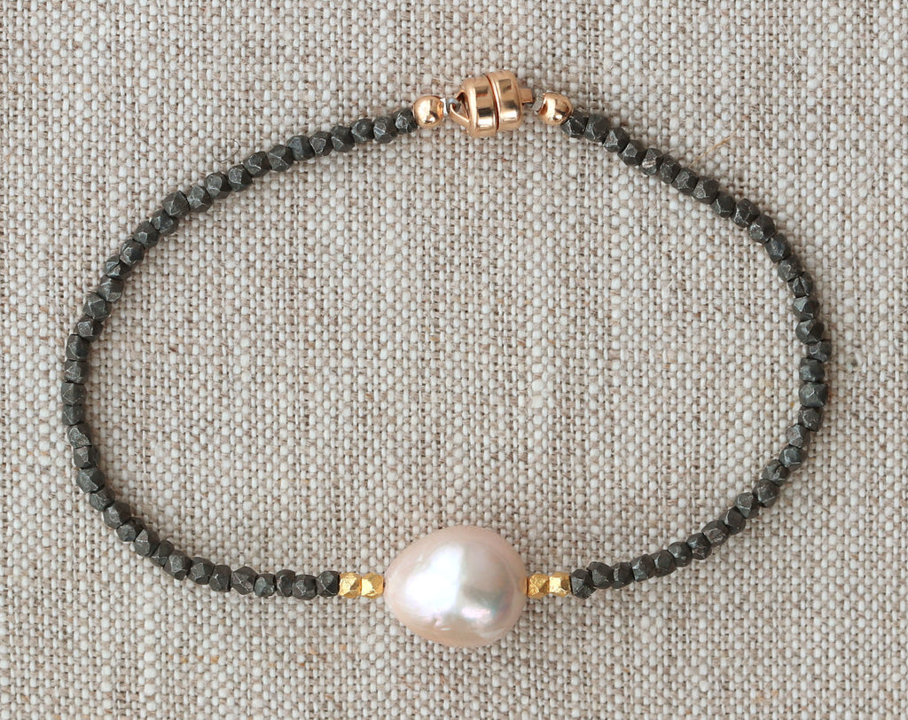 Gold-filled bracelet with pearl and black beads.