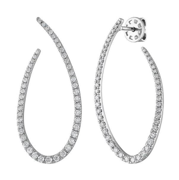Teardrop-shaped diamond earrings in white gold.