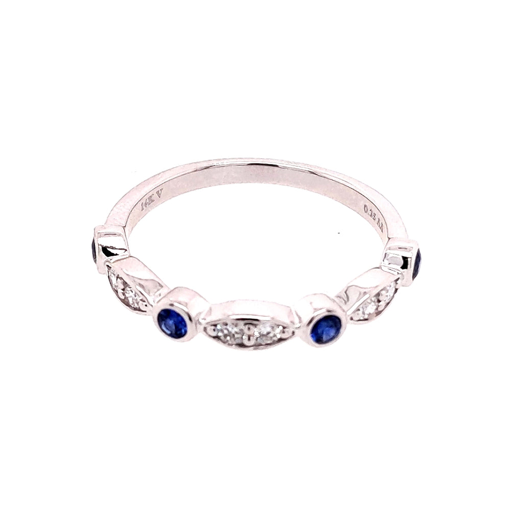 14K white gold band with sapphires.