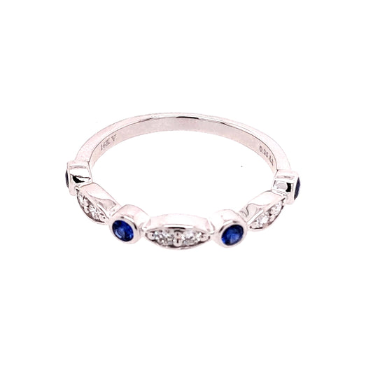 14K white gold band with sapphires.