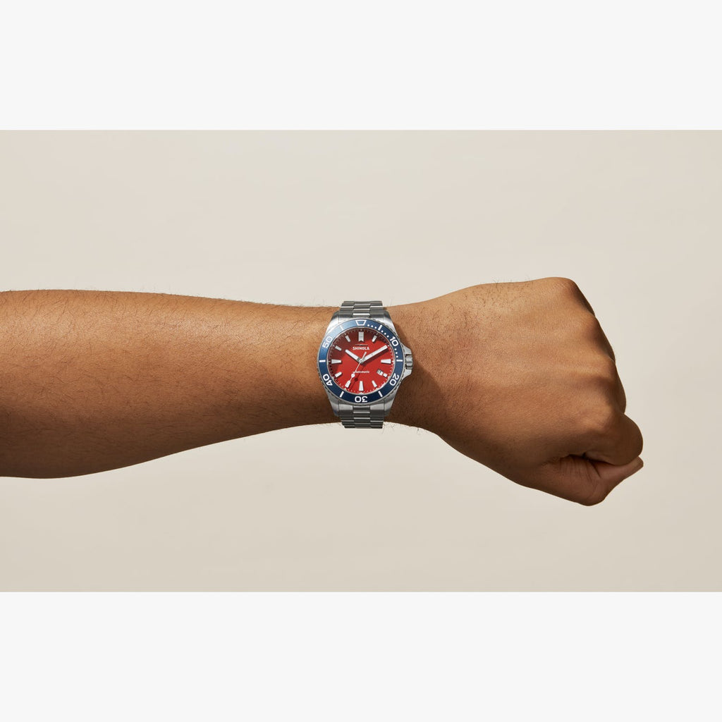 Stainless steel watch with bold red dial.