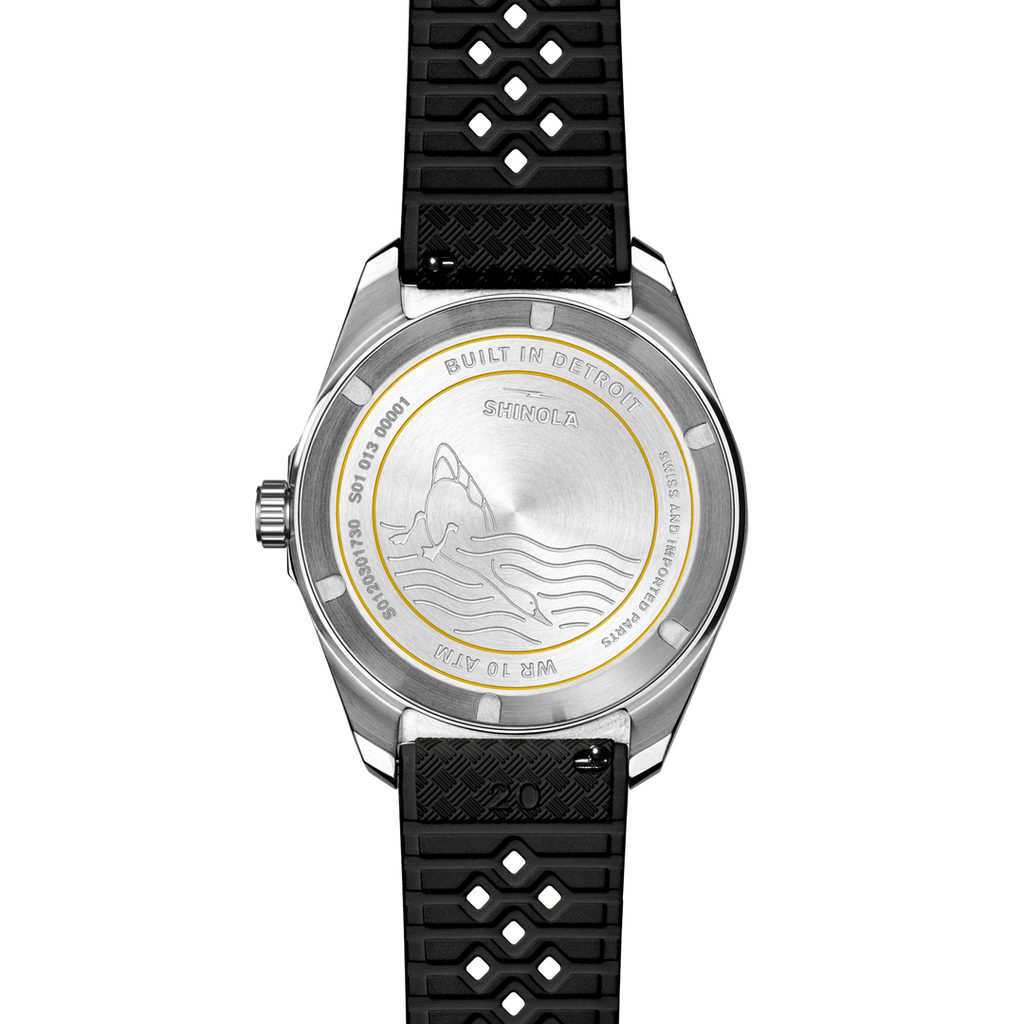 Stainless steel watch with black rubber band.