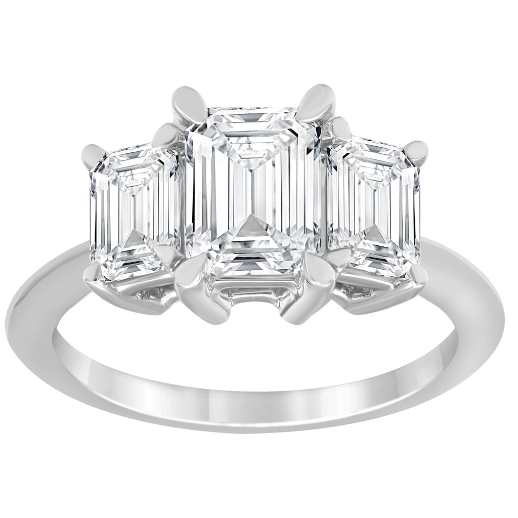 Three-stone emerald-cut diamond ring.