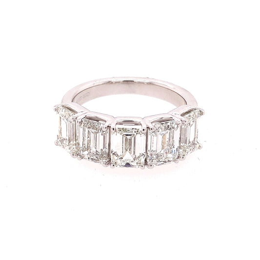 Emerald-cut diamond wedding band.