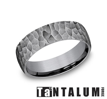 Tantalum grey carved band with granular finish.