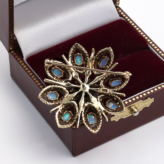 Floral opal pin in 14k yellow gold.