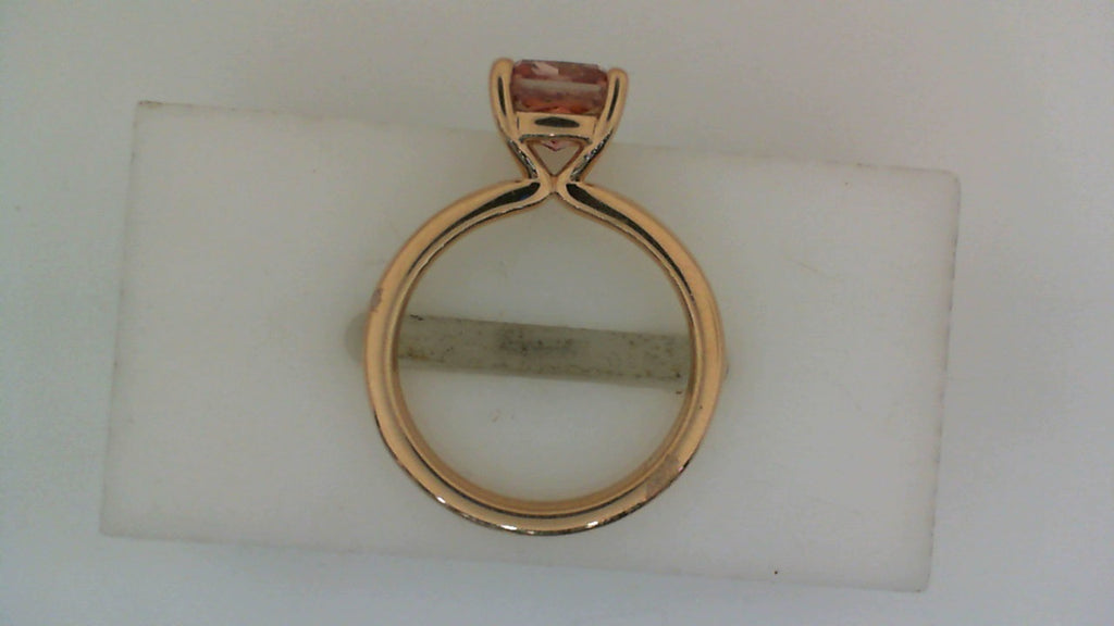 Rose gold ring with pink cushion diamond.