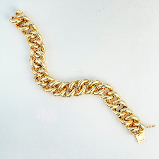 14K yellow gold curb link bracelet.
