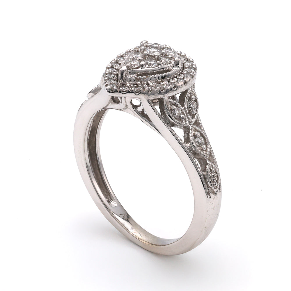 14K white gold ring with round diamonds.