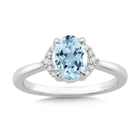 Oval blue topaz ring with diamonds.