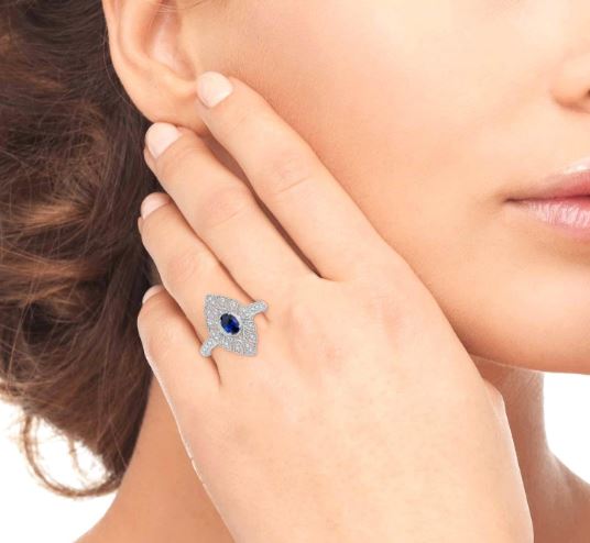 Oval sapphire ring with diamond accents.