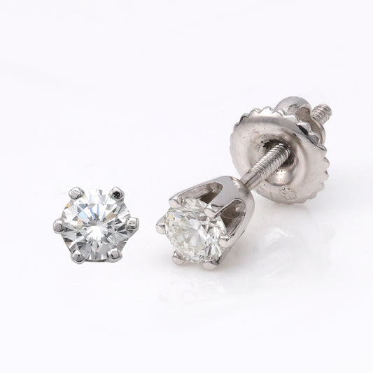 Round diamond stud earrings in white gold.