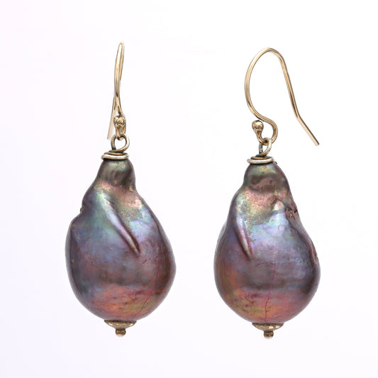 Baroque pearl dangle earrings in yellow gold.
