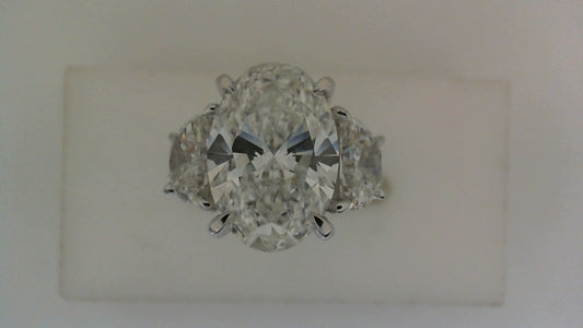 Three-stone oval diamond engagement ring.