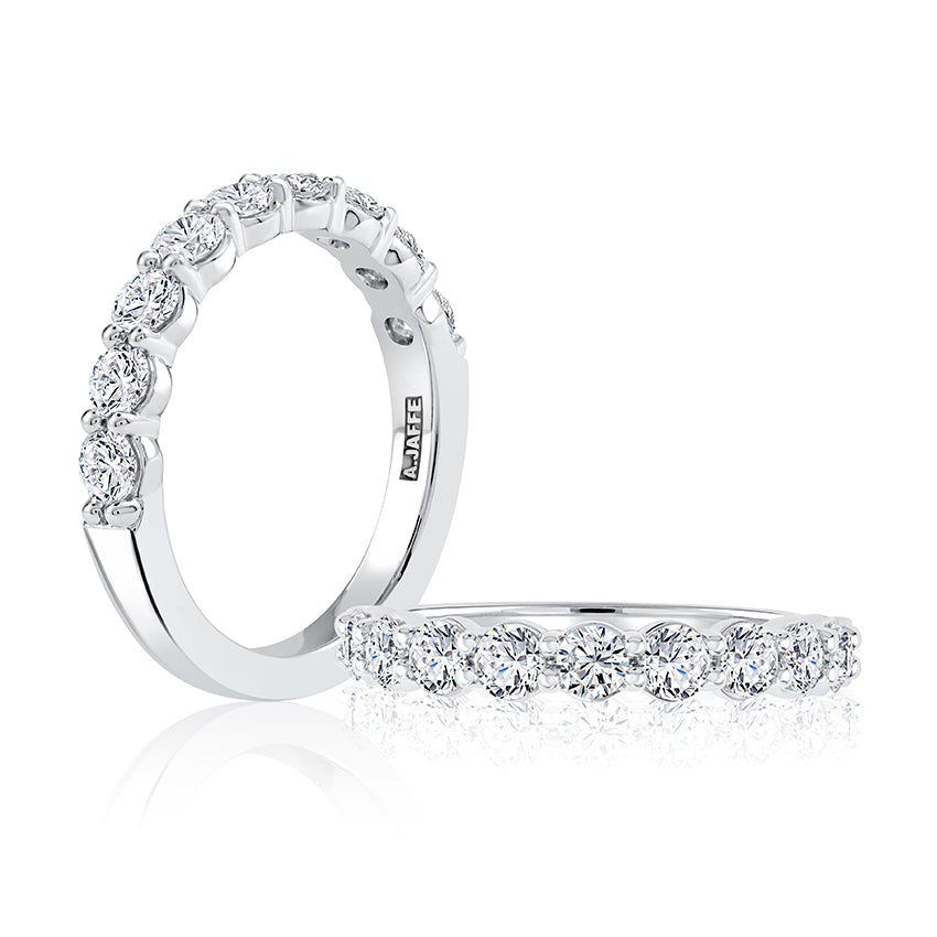 14K white gold band with round diamonds.