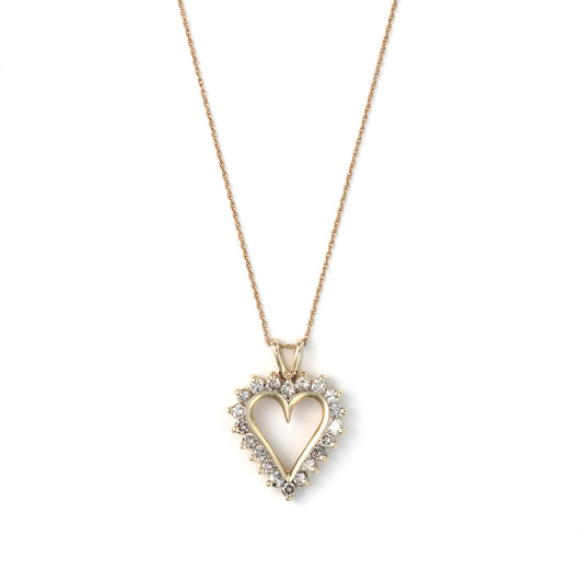 Heart-shaped gold pendant with diamonds.