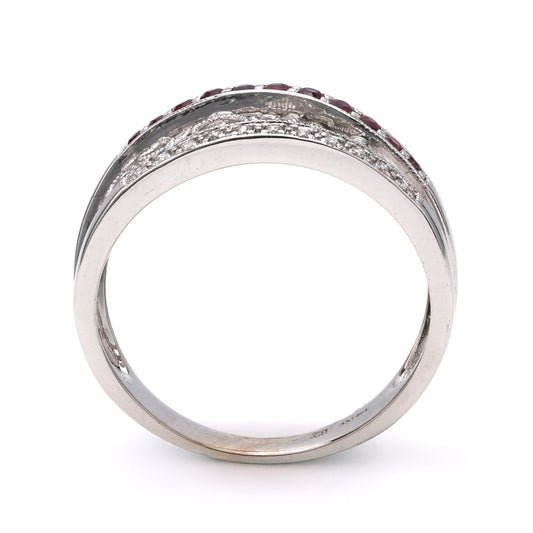14K white gold ring with rubies.