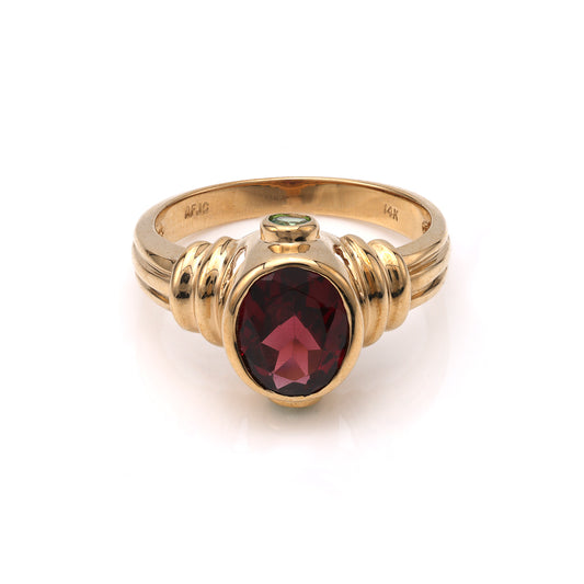 14K gold ring with oval Rhodolite Garnet.