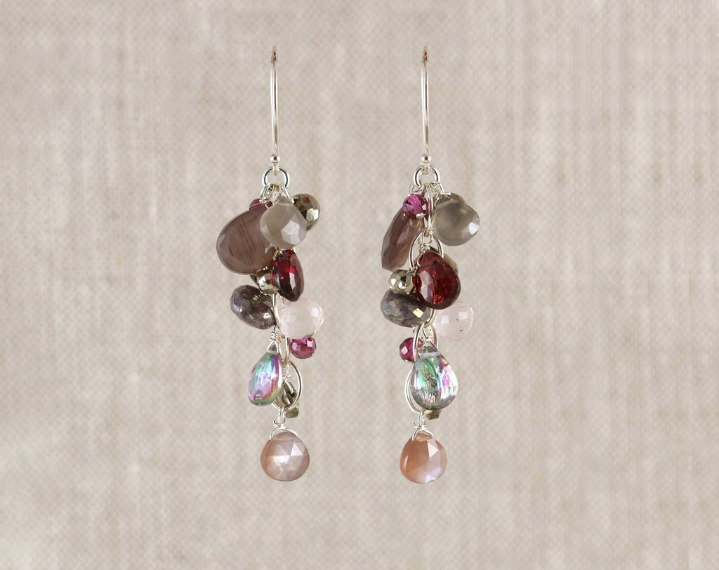 Sterling silver earrings with colorful gemstones.