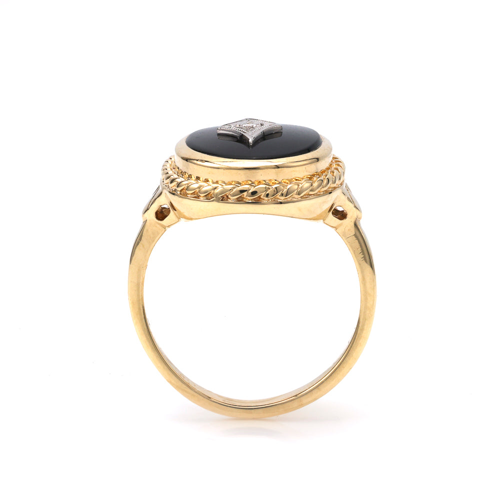 Cabochon onyx ring with diamond accent.