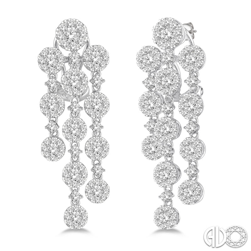 Dangle earrings with round diamond clusters.