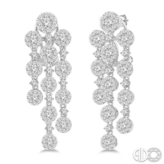 Dangle earrings with round diamond clusters.