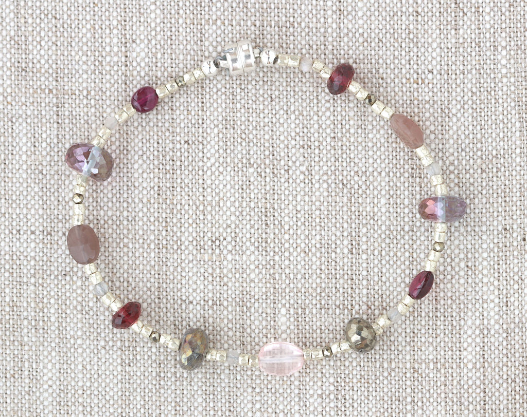 Sterling silver bracelet with colorful gemstone beads.