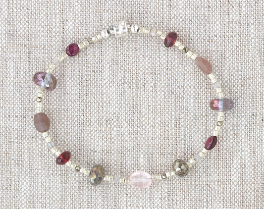 Sterling silver bracelet with colorful gemstone beads.
