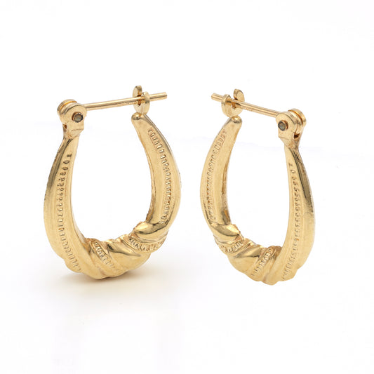 14K yellow gold textured hoop earrings.
