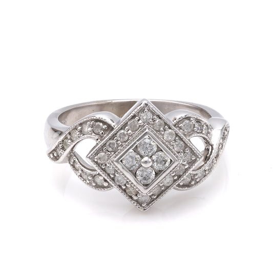 White gold ring with diamond cluster centerpiece.