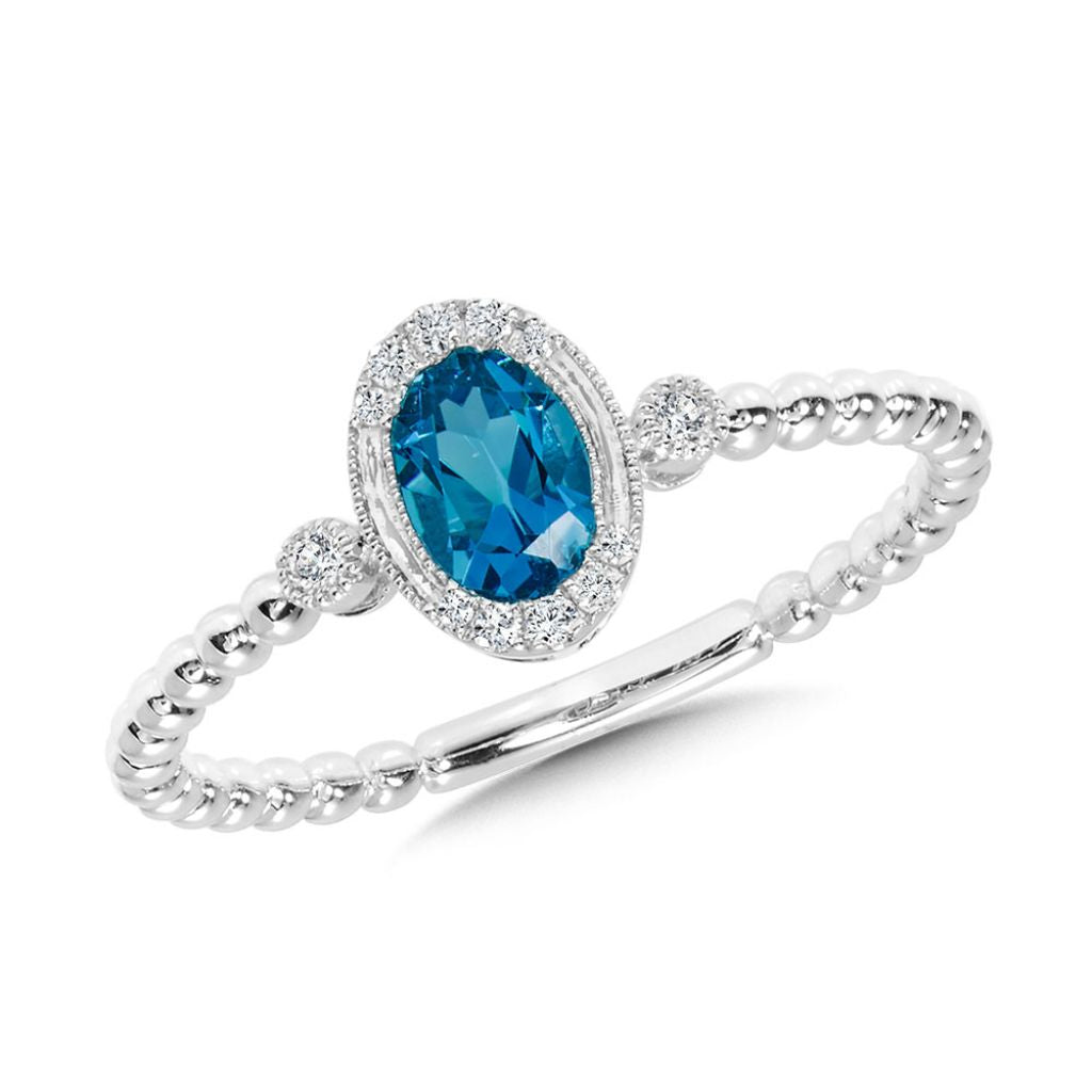 Oval blue topaz ring with diamonds.