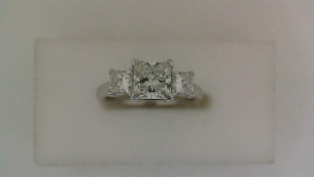 Three-stone princess diamond ring in white gold.