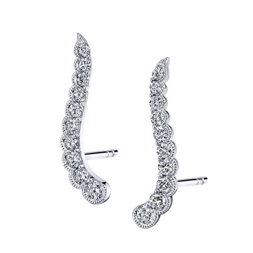 Diamond crawler earrings in white gold.