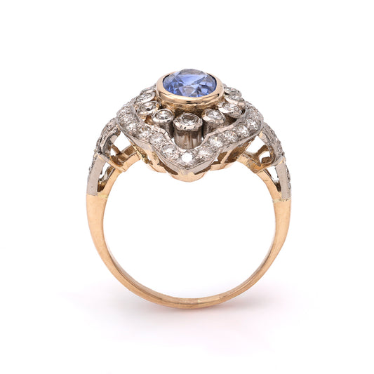 Oval blue sapphire ring with diamond accents.