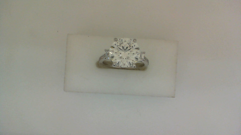18K white gold ring with round diamond.