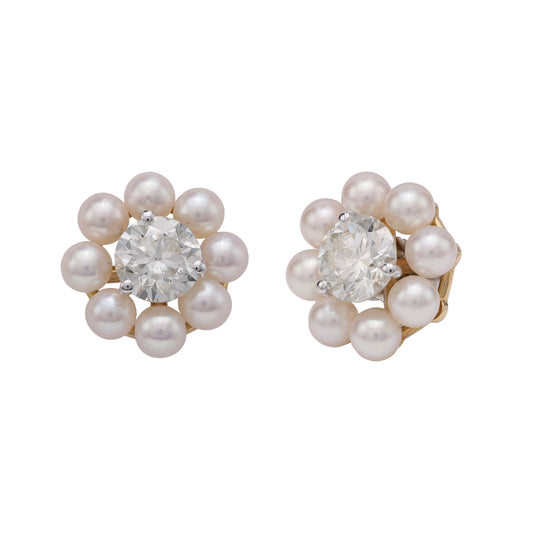 Akoya pearl earrings with central gemstones.
