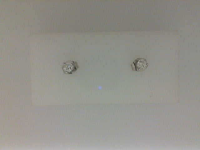 Diamond studs in white gold setting.