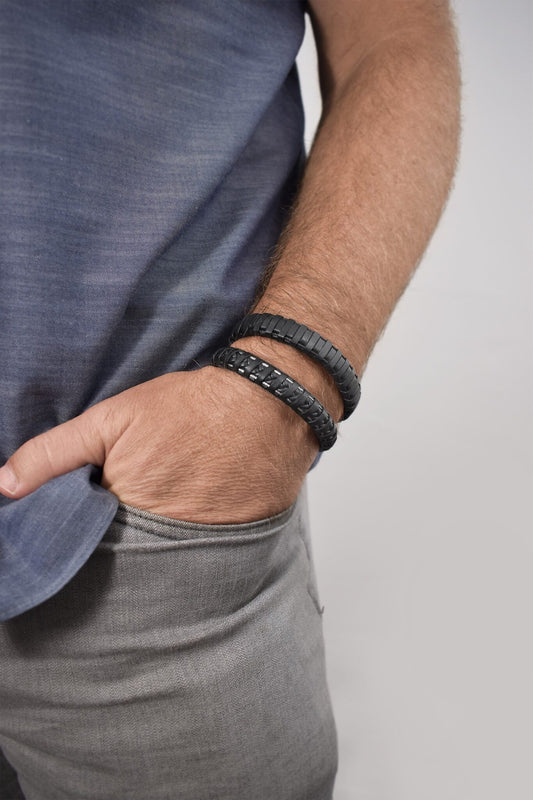 Stainless steel bangle with black leather.