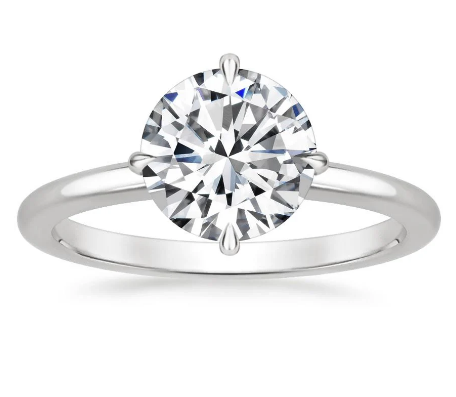 Solitaire ring with round lab-grown diamond.
