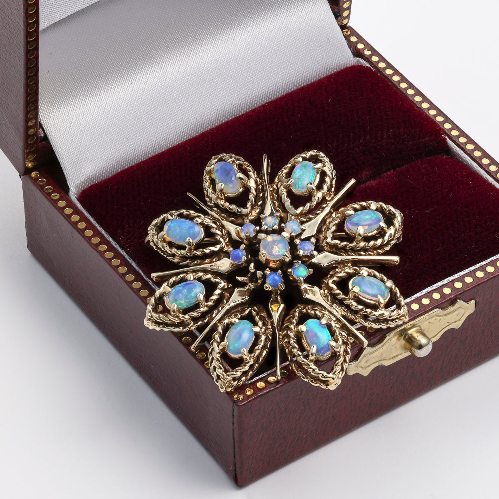 Floral opal pin in 14k yellow gold.