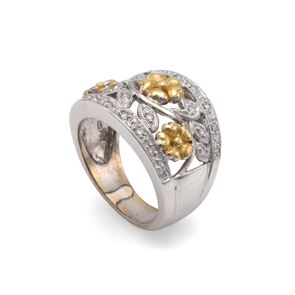 White-yellow diamond ring with floral accents.