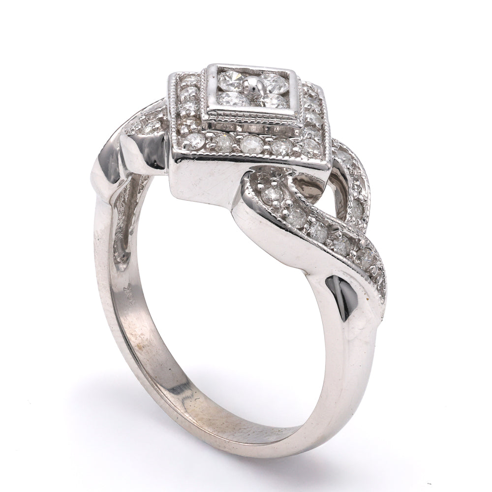 White gold ring with round diamond accents.